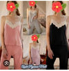 women's pajama or loungewear set in a solid gray color. The ensemble consists of two main pieces: