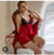 This ensemble is a two-piece lingerie and loungewear set designed with a romantic, vintage-inspired aesthetic. It features a combination of deep red satin-like fabric and delicate black floral lace.