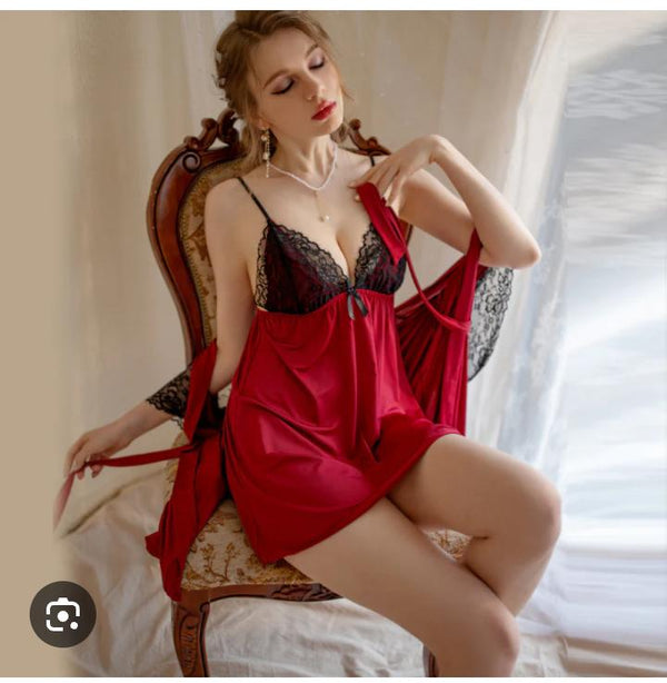 This ensemble is a two-piece lingerie and loungewear set designed with a romantic, vintage-inspired aesthetic. It features a combination of deep red satin-like fabric and delicate black floral lace.