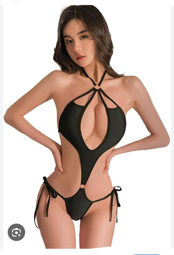 black monokini-style bodysuit characterized by its provocative, minimalist construction and extreme cutout details.